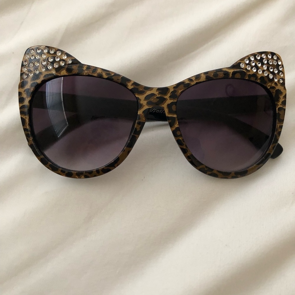 Betsey Johnson “Cat Eyes” sunglasses with rhinestone “ears”.